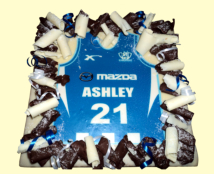 Tee Shirt Cake. The Tee Shirt has actually been cut to shape so that it shows off the icing. Looks good and is very simple.